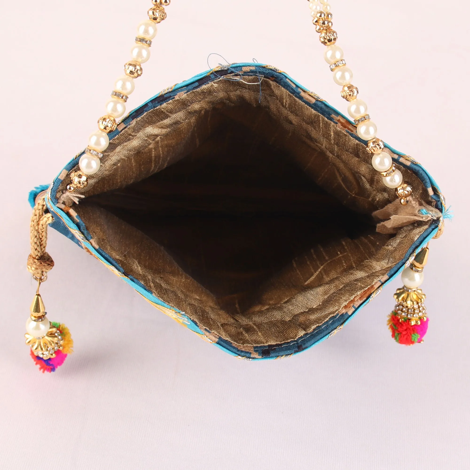 Glitter embellished Blue Ikat Print Potli