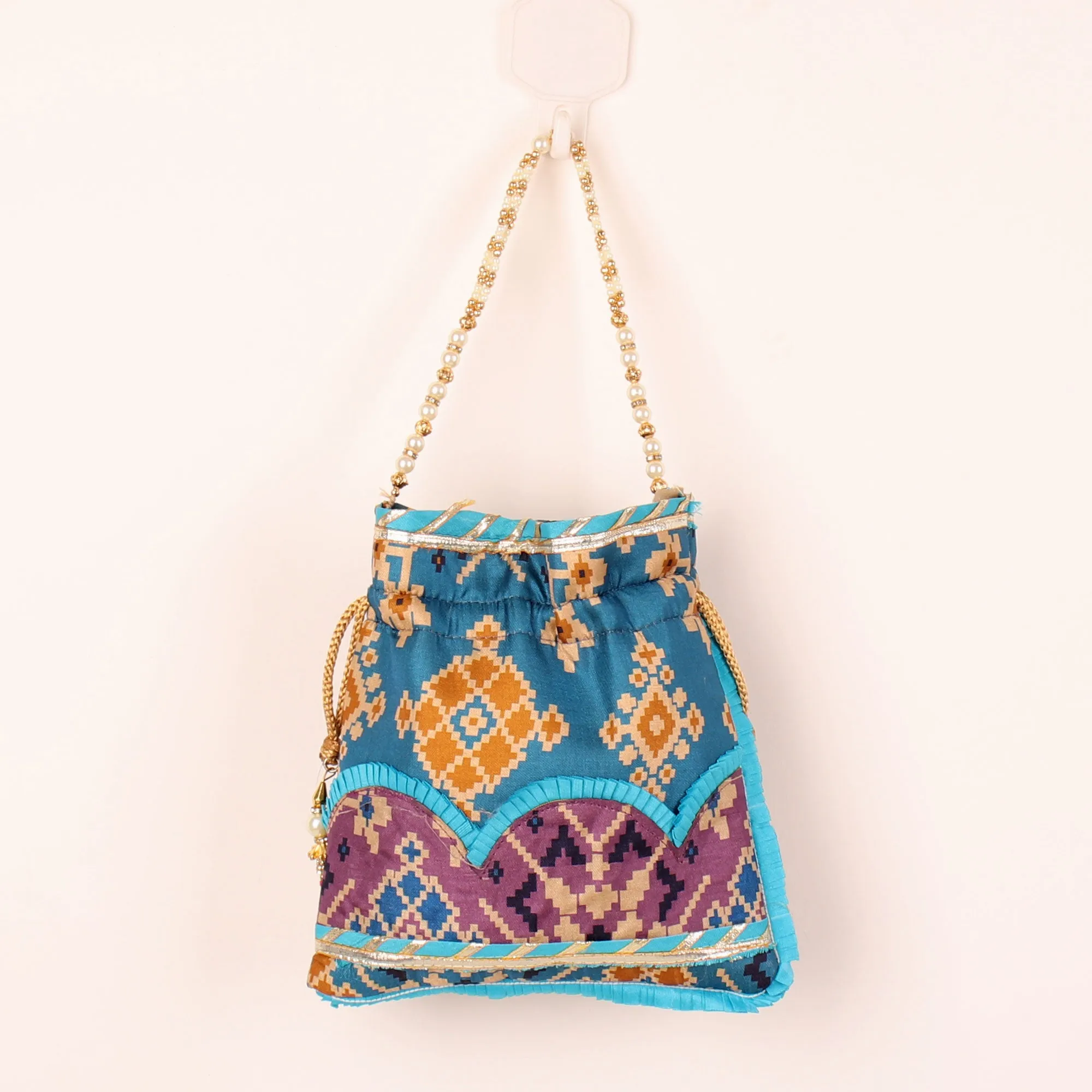 Glitter embellished Blue Ikat Print Potli