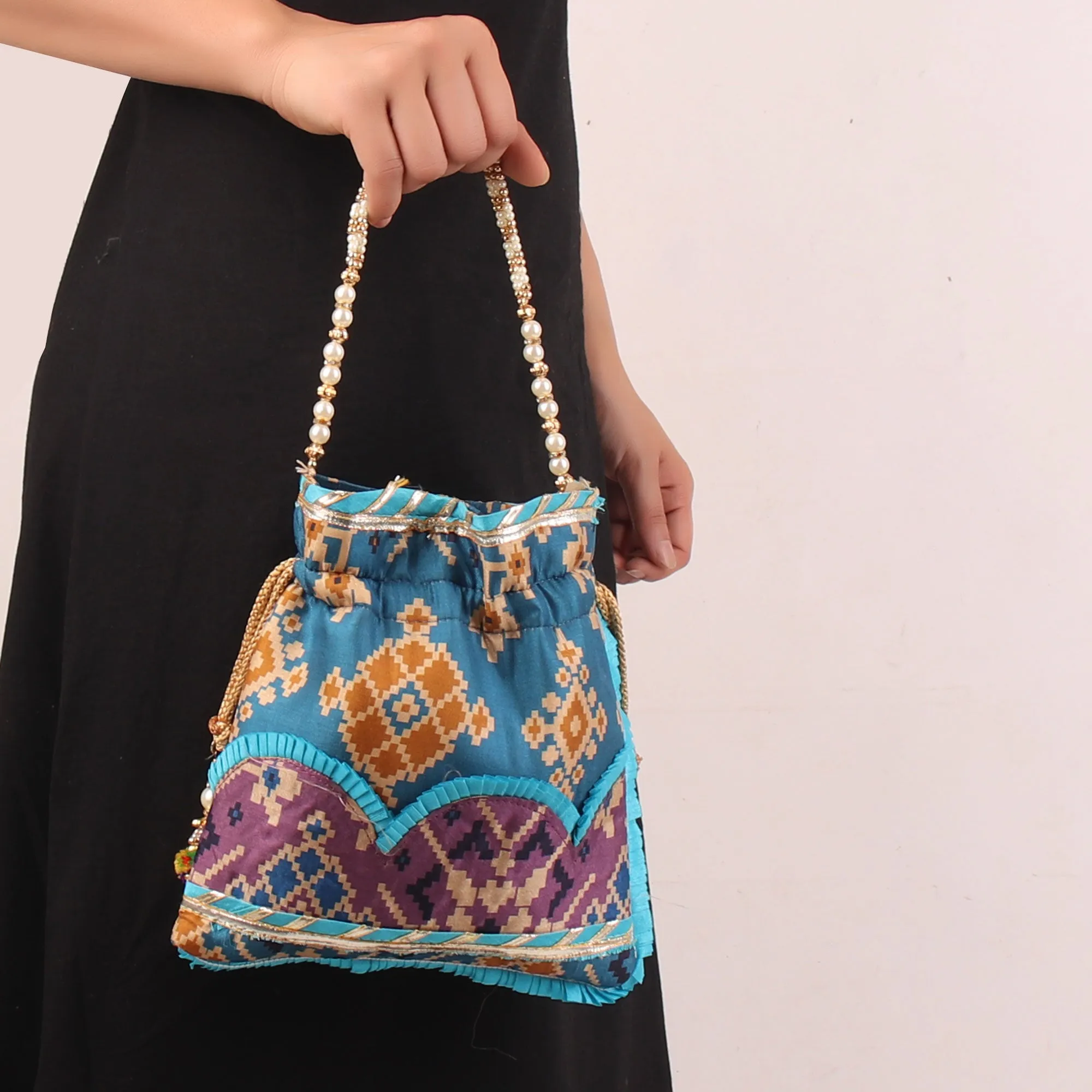 Glitter embellished Blue Ikat Print Potli